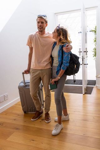 Casual couple ready for travel adventure entryway scene