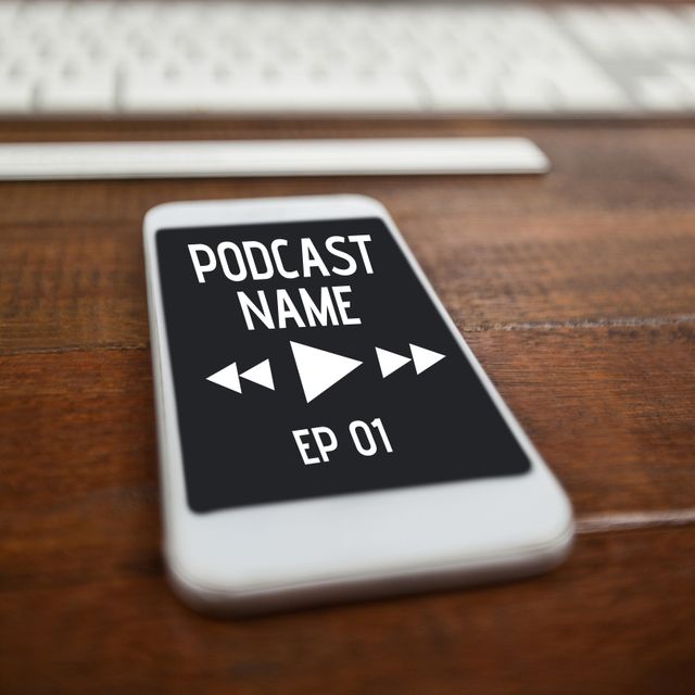 Smartphone lying on wooden table, displaying podcast interface with play button and episode details. Useful for marketing materials for new podcasts, app promotions, or tech illustrations.