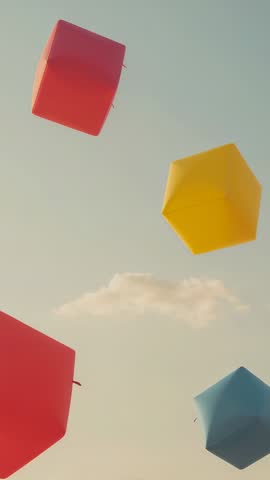Vertical video: Colorful cube lanterns drifting and rotating over pastel sky with single cloud