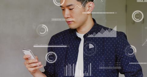 Asian Man Analyzing Financial Data on Smartphone