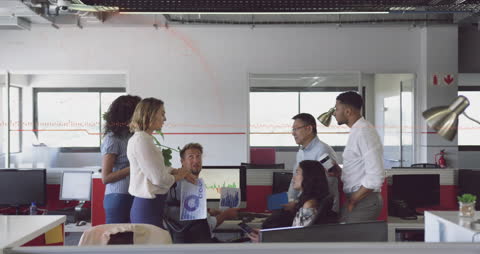 Diverse Business Team Discussing Data Strategies in Modern Office