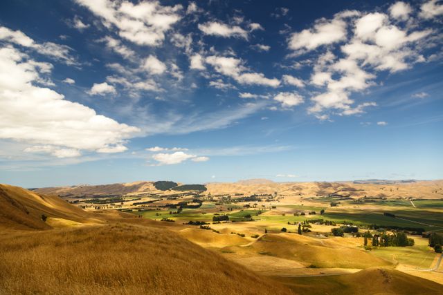 Scenic Golden Valley Stretching Towards Horizon Under Blue Sky - Download Free Stock Photos Pikwizard.com