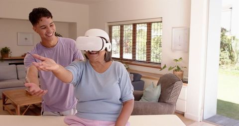 Elderly Woman Using VR Headset for Physiotherapy at Home
