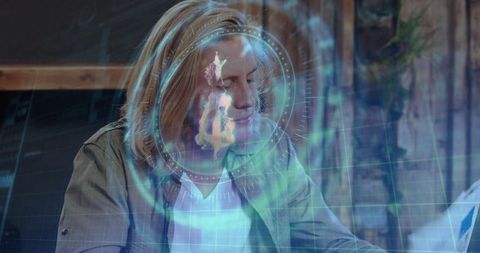 Man analyzing with holographic interface at desk in modern workspace