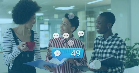 Diverse Team Engaged in Office Discussion with Chat Notifications