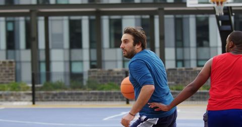 Intense Outdoor Basketball Game With Diverse Players