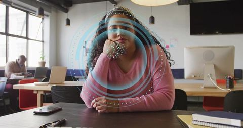Woman in coworking space with digital innovation overlay