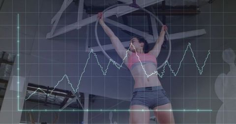Aerial Fitness Enthusiast Training on Hoop with Graph Overlay