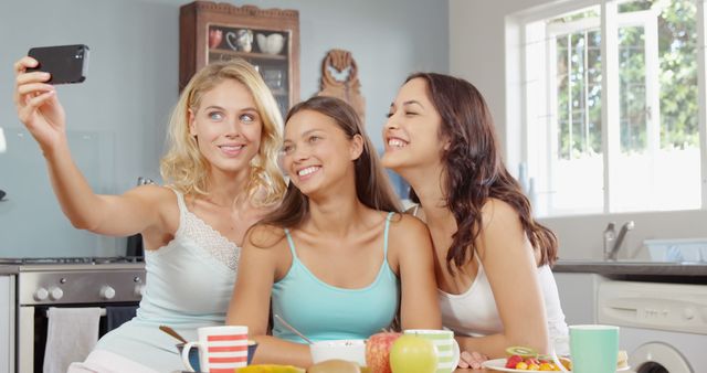 Happy Friends Taking Selfie at Breakfast Table in Cozy Kitchen - Download Free Stock Images Pikwizard.com