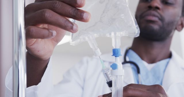 Healthcare Professional Preparing IV Drip and Syringe - Download Free Stock Images Pikwizard.com