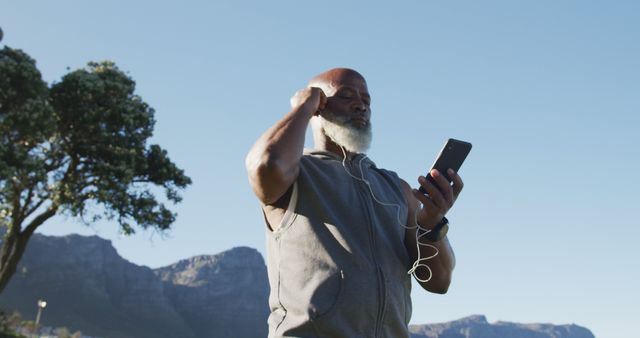 Senior African American Man Listening to Music Outdoors - Download Free Stock Images Pikwizard.com