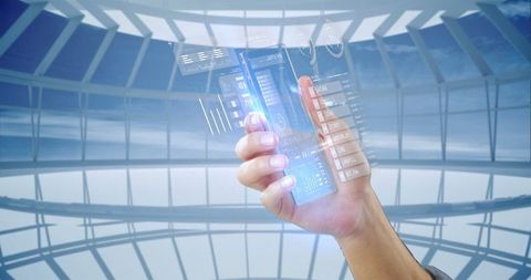 Holding transparent smartphone with futuristic digital interface