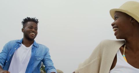 Joyful African American Couple Enjoying Beach Stroll