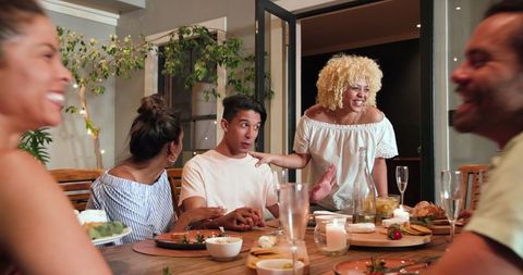 Friends Celebrating with Cheerful Dinner Party Together