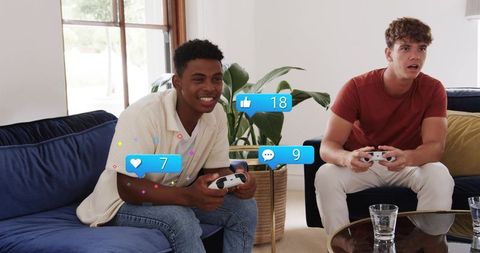 Playing video games on couch with social media reaction overlays and controllers