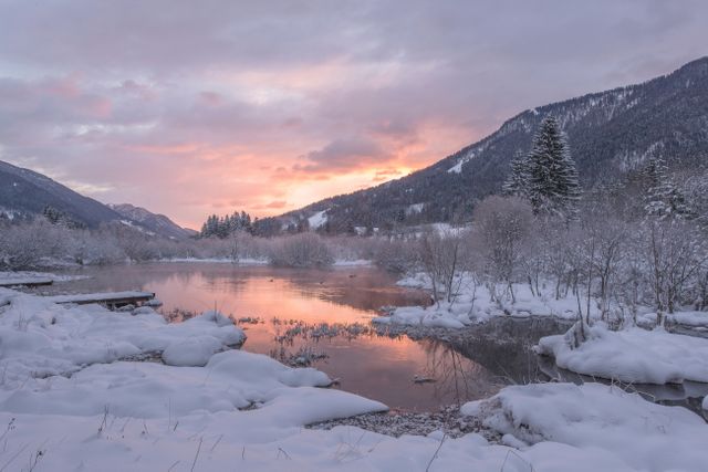 Snow-covered mountains and river at sunset in winter landscape - Download Free Stock Photos Pikwizard.com