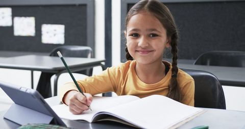 Efficient Student Using Notebook and Tablet in Classroom - Download Free Stock Images Pikwizard.com
