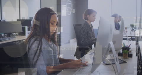 Contemporary Workplace with Focused Professionals on Computers