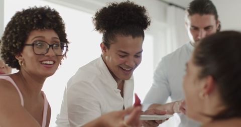 Friends Smiling and Socializing at Joyful Wedding Reception