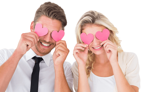 Smiling Couple Holding Pink Heart Cutouts Over Eyes Transparent Background