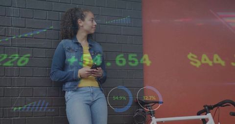Young Woman Using Smartphone Showing Data Projection in City