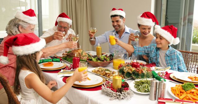 Family Celebrating Christmas Dinner with Santa Hats Toasting Around Festive Table - Download Free Stock Images Pikwizard.com