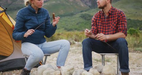 Couple Enjoying Campfire Meal in Picturesque Mountain Setting - Download Free Stock Images Pikwizard.com
