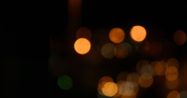 View shows vibrant bokeh effects with various colorful lights in dark environment, making it perfect choice for background designs, abstract themes, wallpapers, or illustrating concepts related to nightlife, city lights, or festive ambiance.