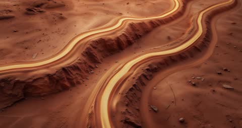 Futuristic Glowing Tracks Winding Through Red Deserts