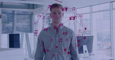 Standing man wearing light grey button-up shirt with magenta network projection in modern office
