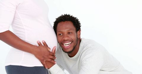 Expectant couple embracing parenthood with joyful anticipation