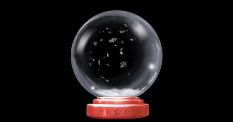 Elegant decorative snow globe with festive red star base