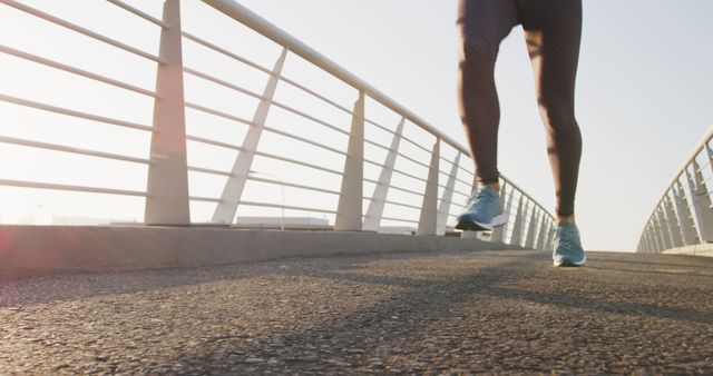 Closeup Low Angle View of Female Runner on Urban Bridge - Download Free Stock Images Pikwizard.com