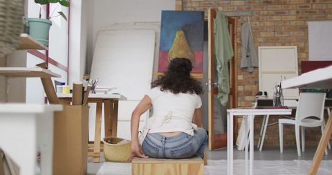 Artist Organizing Bright Studio Amidst Creative Atmosphere - Download Free Stock Images Pikwizard.com