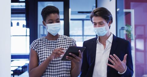 Business Professionals Discussing with Tablet While Wearing Masks in Office - Download Free Stock Images Pikwizard.com