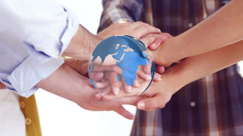 Diverse Team Joining Hands with Rotating Globe Overlay
