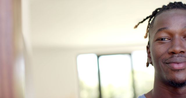 Close-Up of Smiling Young Man with Twisted Braids in Modern Interior - Download Free Stock Images Pikwizard.com