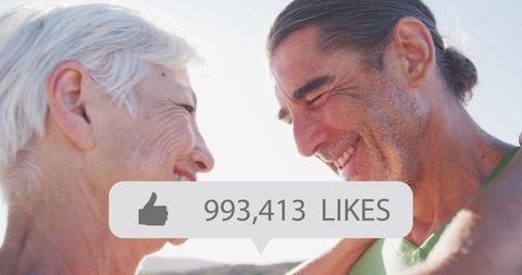 Senior Couple Enjoying Moment with Social Media Likes Overlay
