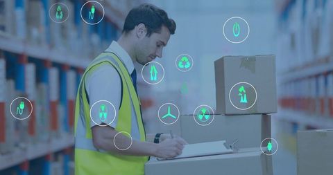 Warehouse worker checking inventory with AR icons on stacked boxes in distribution center