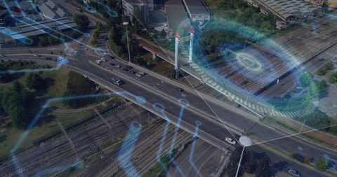 Aerial smart city traffic monitoring overpass with rail interchange and digital overlay