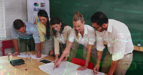 Diverse Business Team Analyzing Financial Data at Office Table