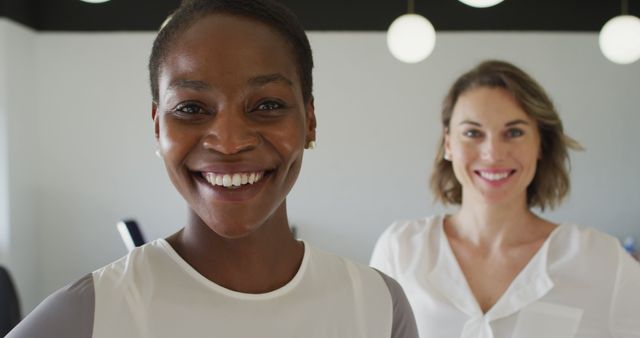 Smiling Diverse Women in Modern Office Environment - Download Free Stock Images Pikwizard.com