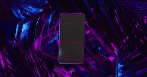 Futuristic neon smartphone floating over glossy monstera leaves with circling light rings