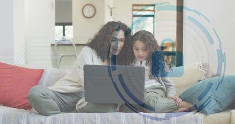 Mother and daughter learning online on sofa with futuristic hud overlay for remote education