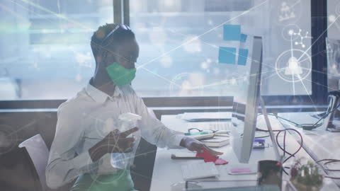 Office Worker Cleaning Desk with Technological Overlays