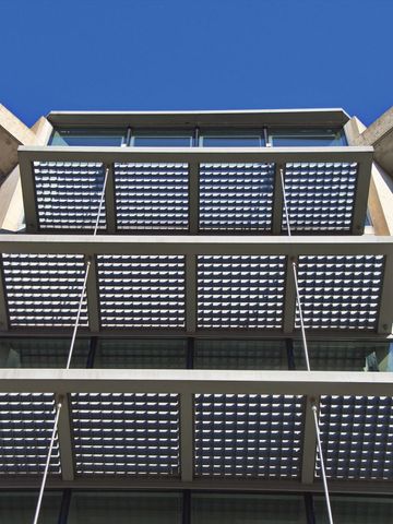 Modernled Solar Panel Grid with Blue Sky Background