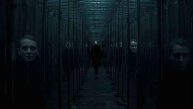 Solitary Woman Walking Through Futuristic Glass Corridor