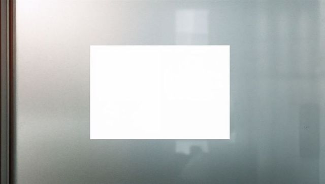 Minimalist Blank Display Panel on Frosted Glass Surface