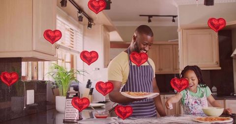 Father and daughter baking homemade pizza together celebrating family bonding and joy