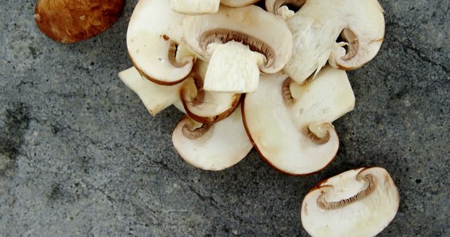 Sliced Mushrooms on Concrete Background - Download Free Stock Images Pikwizard.com